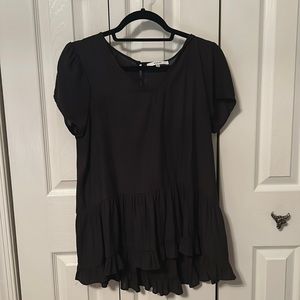 Black short sleeve top with bottom detailing